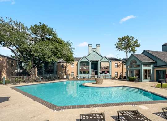 the large swimming pool and expansive sundeck at Waters at Westchase Apartments in Houston, TX