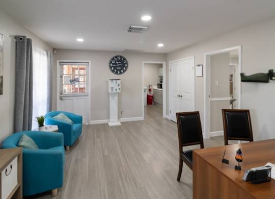 the leasing office with seating at The Forest Apartments in Houston, TX