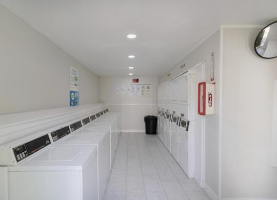 The on-site laundry center with washers and dryers at The Forest Apartments