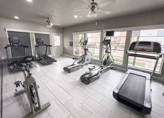 a fully equipped fitness center at Crosby at Westchase Apartments for rent in Houston, Texas