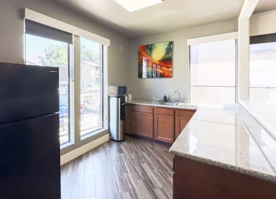 a kitchen area in the resident clubhouse at Hudson at Westchase Apartments in Houston, Texas