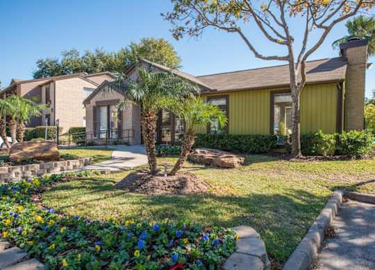 Lush, professional landscaping at Hudson at Westchase Apartments in Houston