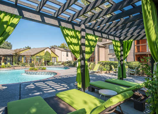 a resort-style cabana around a lagoon-inspired pool at Hudson at Westchase Apartments