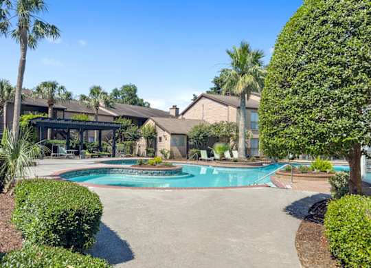 The resort-style pool and sundeck at Hudson at Westchase Apartments
