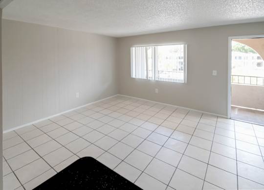 a tiled living room with a large window at Waterview Crossing