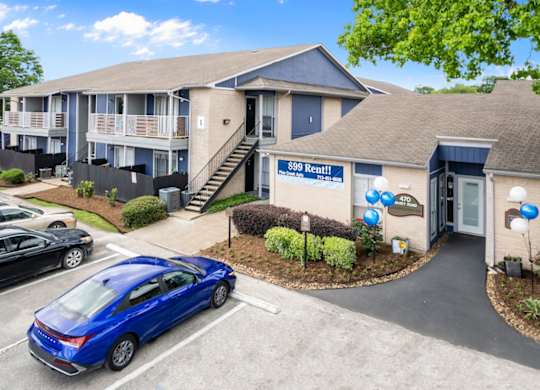 parking in front of the leasing office and clubhouse at Pine Creek Apartments