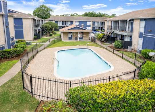 an aerial view a sparkling pool at Pine Creek Apartments in Houston