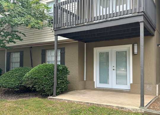 a front door of a house with a balcony at Spring Lake Cove Apartments, Alabama