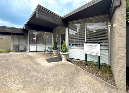 the front of a building with a driveway and a sign in front of it at Spring Lake Cove Apartments, Birmingham, AL 35215