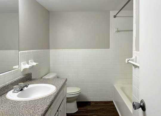 a bathroom with a sink toilet and a bath tub at Spring Lake Cove Apartments, Birmingham, 35215