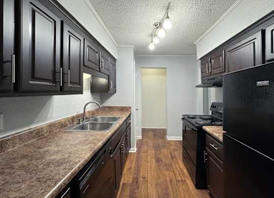 a classic apartment kitchen with ample cabinetry at Ascot Place Apartments, Birmingham, 35235