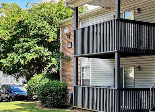 a balcony on the side of a apartment building at Ascot Place Apartments, Birmingham, 35235