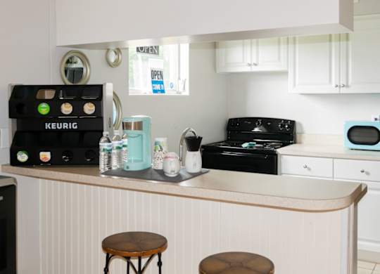 the kitchen area with coffee bar in the Park Apartments Office