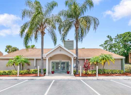ample parking in front of the Winford Place Leasing Office with tall palm trees