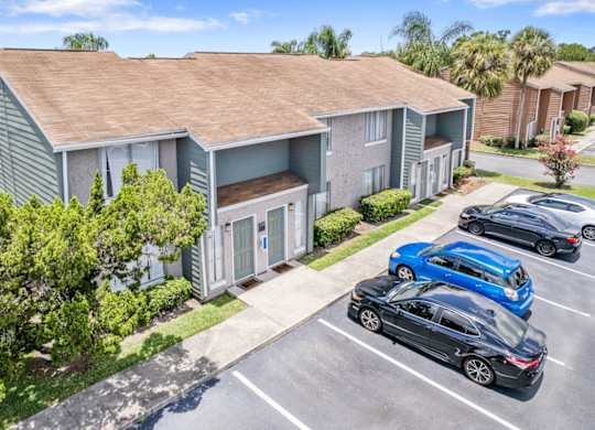 Well-kept residential buildings and ample parking at Winford Place Apartments in Orlando