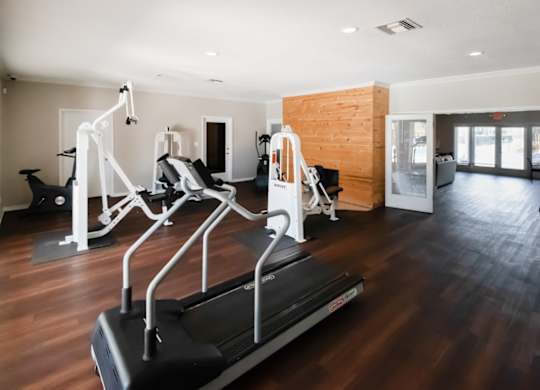 the fitness center with strength and cardio equipment at Winford Place