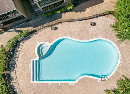 one of two sparkling blue pools and expansive sundeck at Kirkwood Landing Apartments