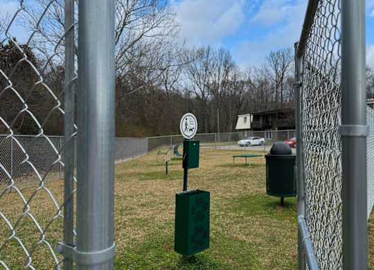 A chain link fence with a sign on it.