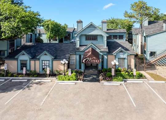 the large clubhouse and ample parking at Waters at Westchase Apartments for Rent in Houston