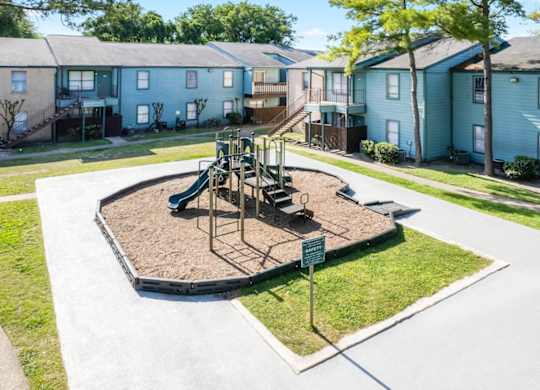 the modern playground at Waters at Westchase Apartments in Houtson