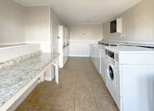 a large laundry center for residents at Waters at Westchase Apartments