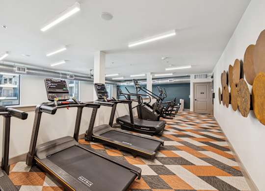 Fitness center treadmills at 1900 Parmer Apartments in Austin TX