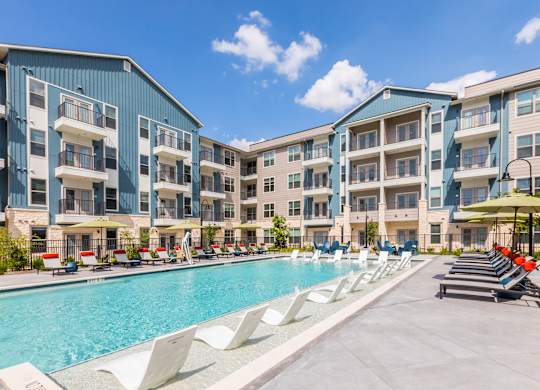 Poolside seating at 1900 Parmer Apartments in Austin TX