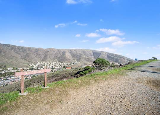 Sign on a hill at Altitude Apartments in South San Francisco CA