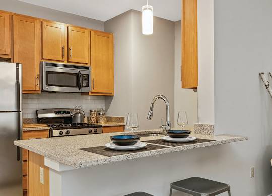 Kitchen seating at Axis Admirals Hill Apartments in Chelsea MA