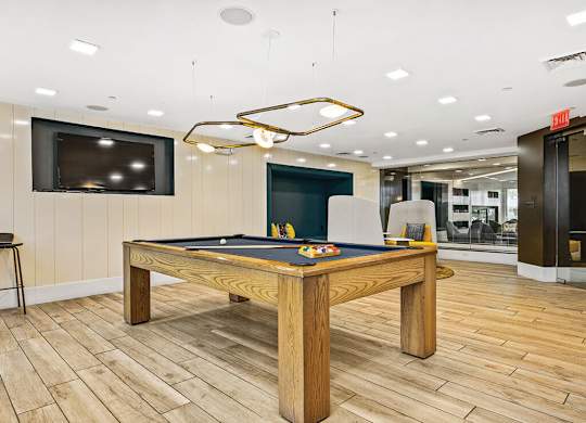 Game area at Axis Admirals Hill Apartments in Chelsea MA