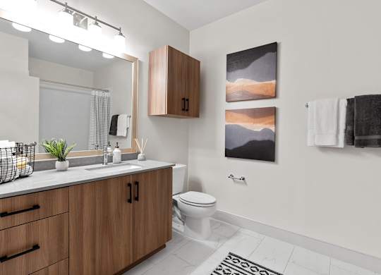 Bathroom with tiled flooring at VERO Apartments in Chelsea MA