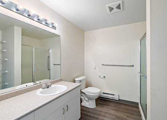 Bathroom with sink and shower at Ballinger Court Senior Apartments in Edmonds WA