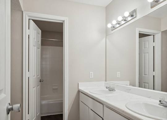 Bathroom with closet at Park Village Apartments in Conroe TX