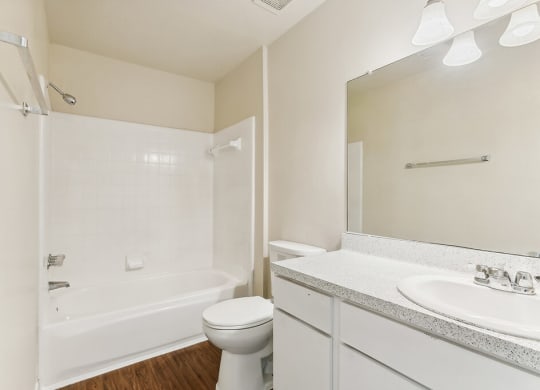 Bathroom with white cabinets at Sterling Green and Sheldon Ranch in Channelview TX