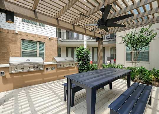 Outdoor grill area at The Sevens in Dallas TX