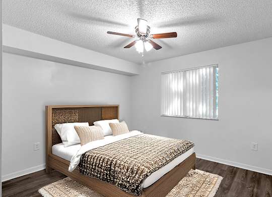 Bedroom with ceiling fan at Cedar Grove Apartments in Miami FL