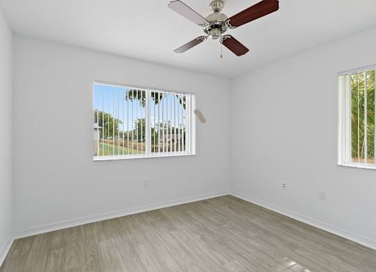 Bedroom with ceiling fan at Brenton at Abbey Park Apartments in West Palm Beach FL