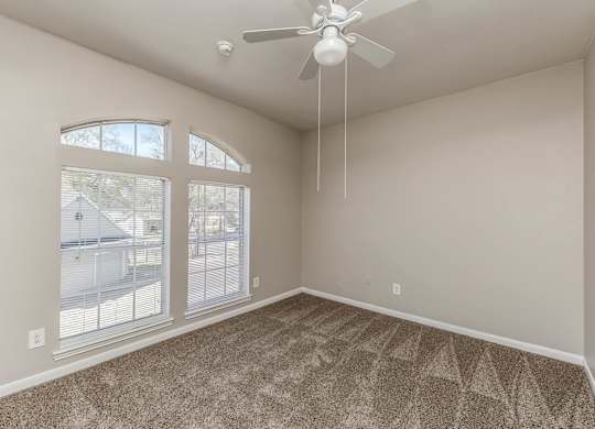 Bedroom with large window at Hollow Creek in Conroe TX