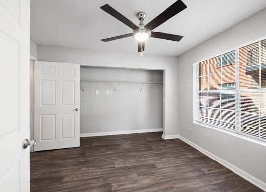 Bedroom with ceiling fan at Forest Creek Apartments in Houston TX