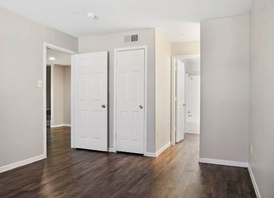 Bedroom with closet at Park Village Apartments in Conroe TX