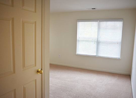Bedroom at Whispering Oaks Apartments in Portsmouth VA