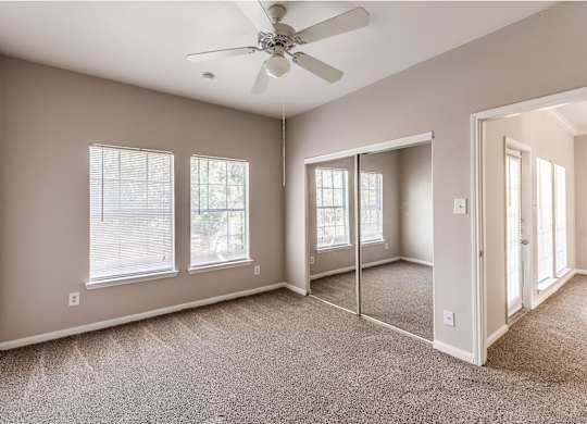 Bedroom with ceiling fan at Hollow Creek in Conroe TX