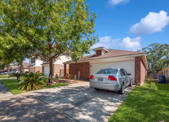 Car parked in driveway at Sterling Green and Sheldon Ranch in Channelview TX