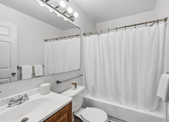 Bathroom with shower at Riverwoods Apartments in Woodbridge VA
