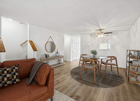 Living room with ceiling fan at Riverwoods Apartments in Woodbridge VA