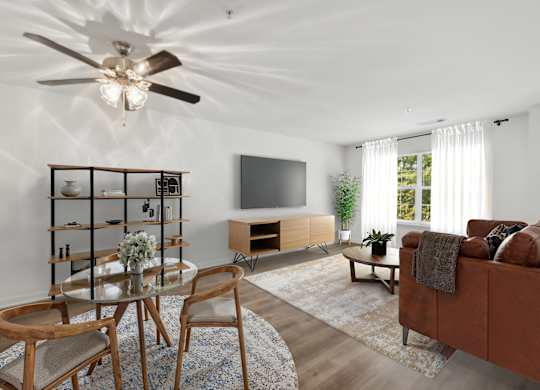 Living room with window at Riverwoods Apartments in Woodbridge VA