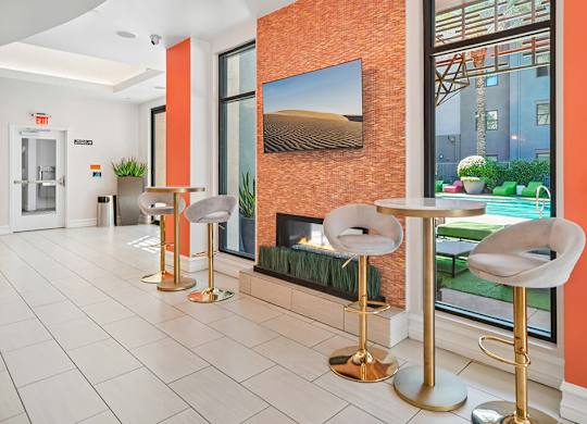 A room with a fireplace and a painting on the wall.