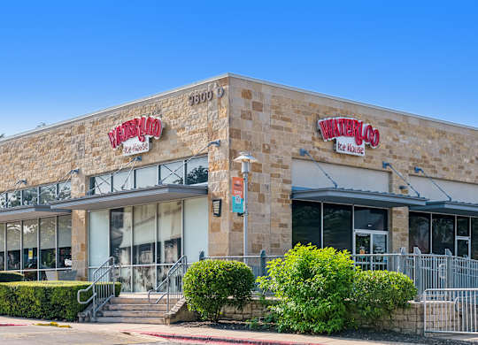The exterior of a building with the name