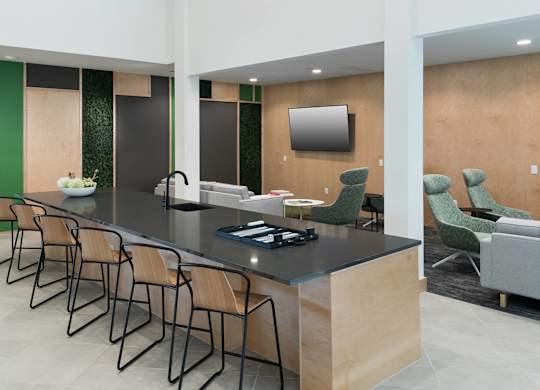 Clubhouse island seating at Jada Legacy Central Apartments in Plano TX