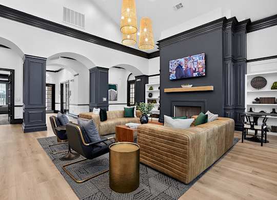 A living room with a fireplace and a large bed.